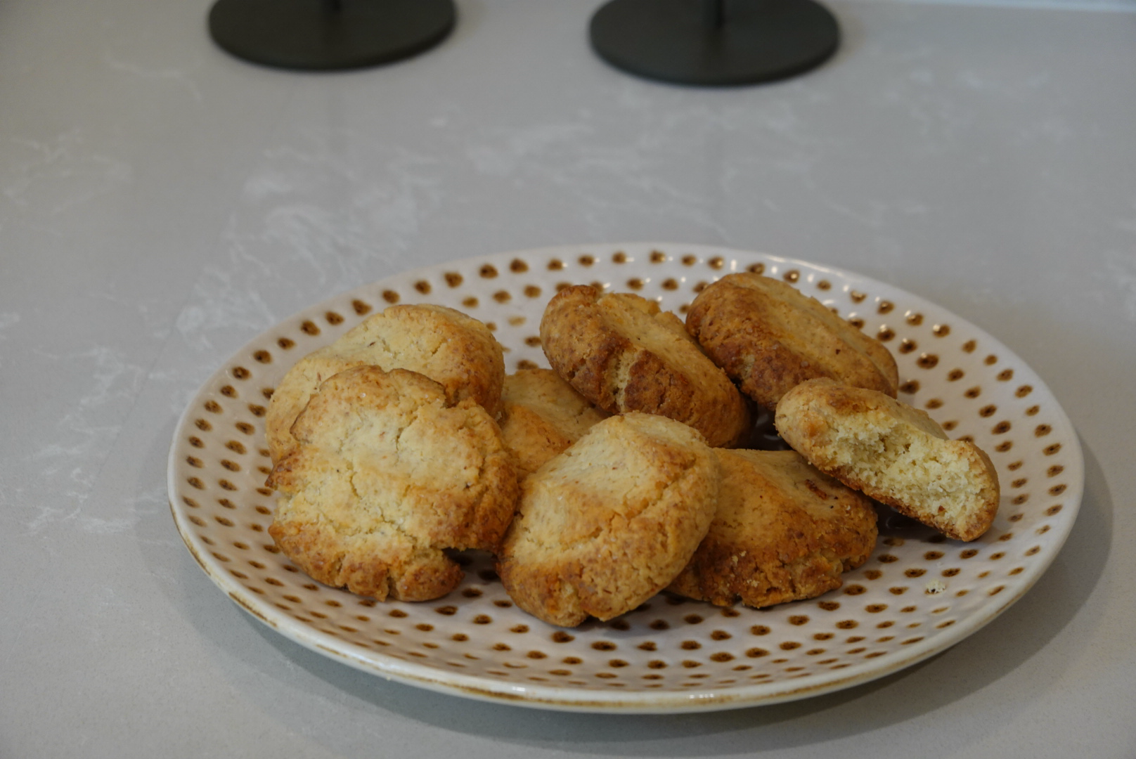 Tahini lemon cookies on a speckled plate