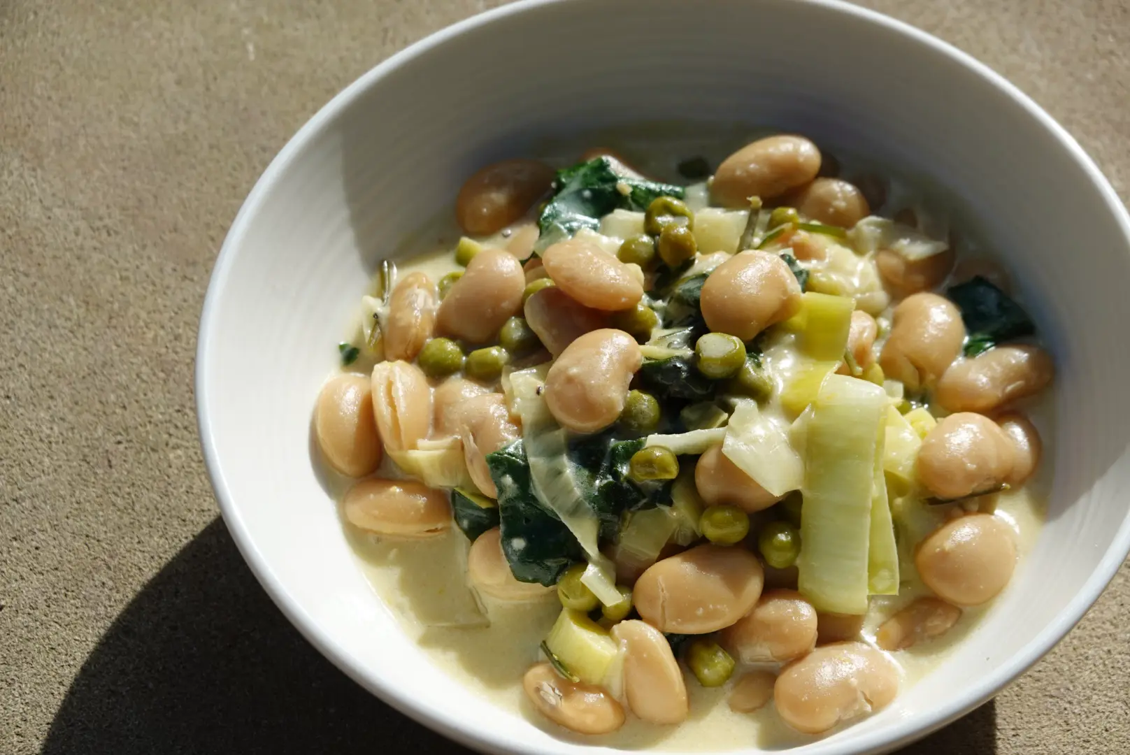 Marry Me creamy butter beans with peas and greens